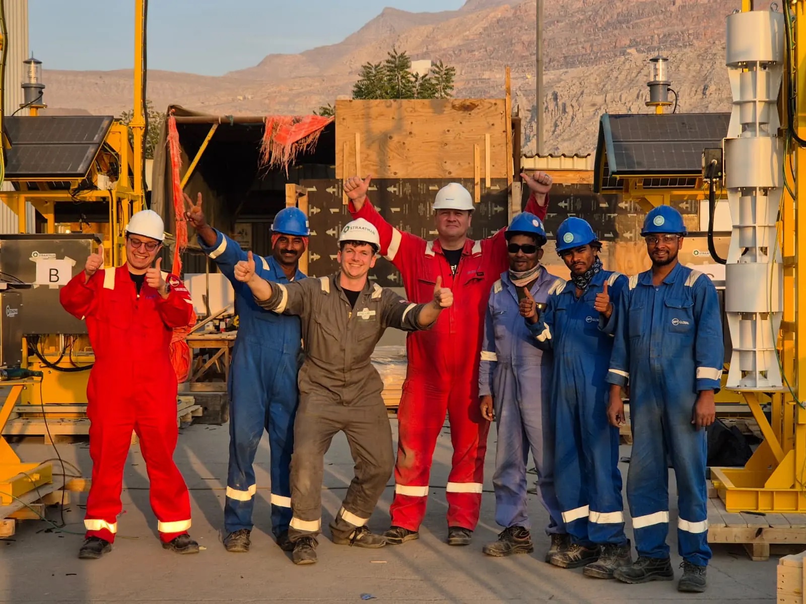 Project personnel in front of buoy control equipment assembled at a UAE yard for the Bluewater Oman CBM package