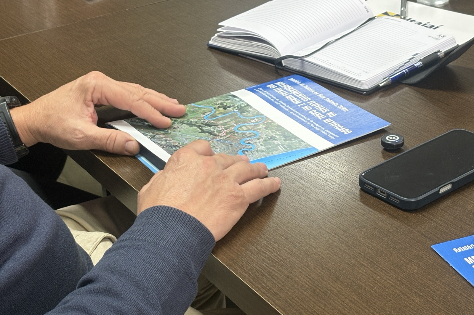 Close view of an Itajaí-Mirim river-improvement plan and map during a June 2026 municipal and state Civil Defense meeting