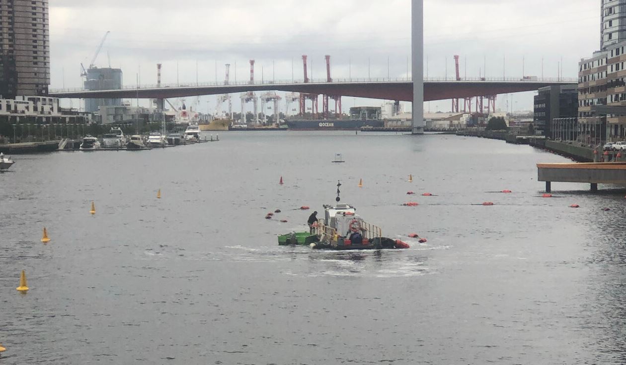 Lower Yarra River maintenance dredging vessel operating inside buoyed work limits upstream of Bolte Bridge