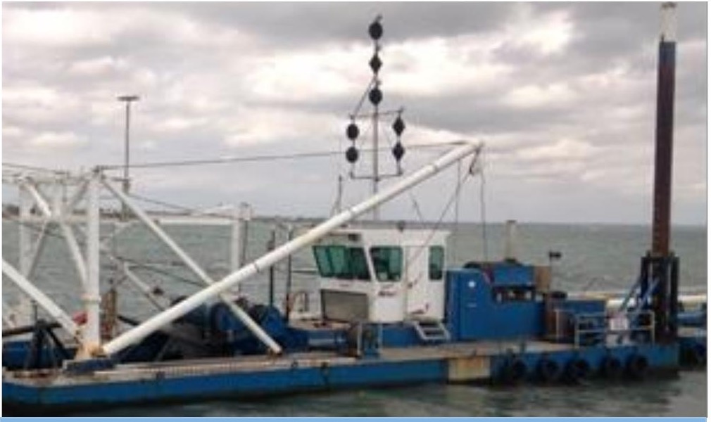 Cutter-suction dredger performing maintenance dredging at Portarlington Harbour with navigation day shapes displayed