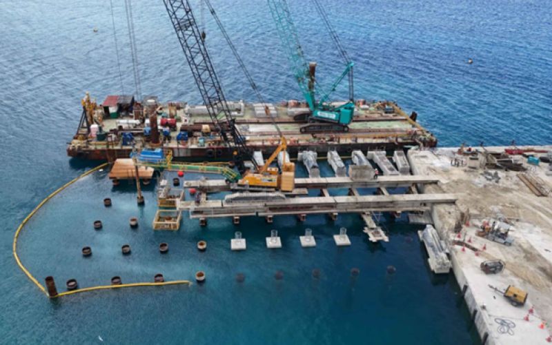 Aerial view of marine piling, work barges and new wharf beams during Stage 2 at Queen Salote International Wharf