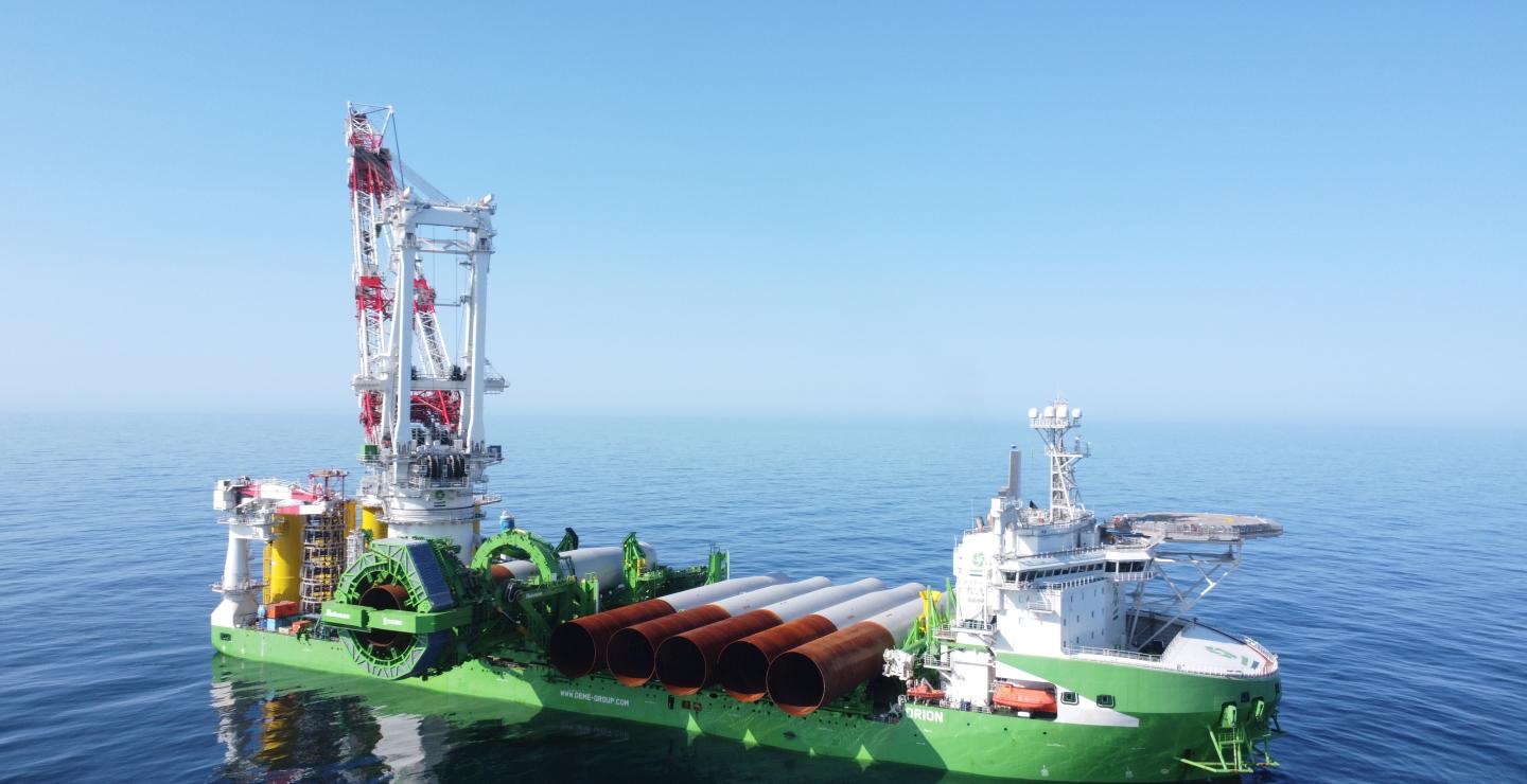 DEME offshore installation vessel Orion carrying monopiles in the image published with the Zeevonk foundation contract announcement
