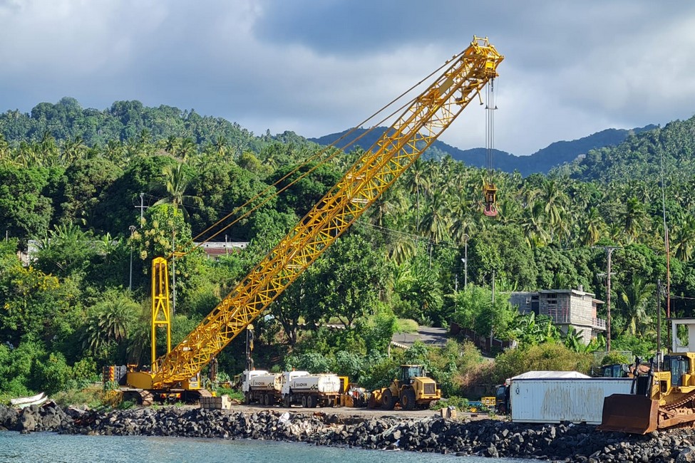 The Arab Contractors crawler crane and earthmoving equipment working on the Boingoma Port shoreline on Moheli