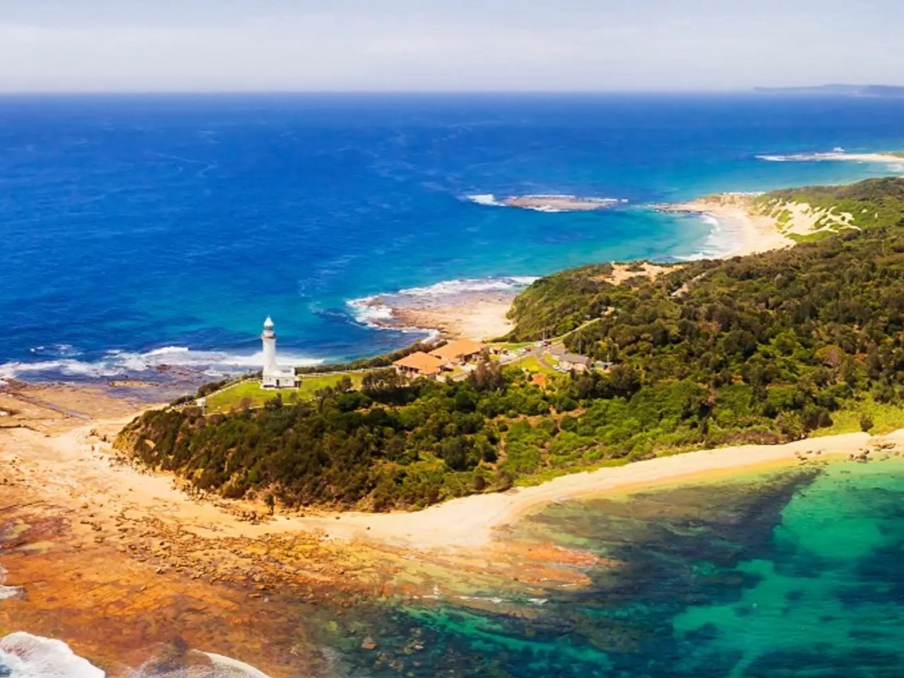 Aerial view of Norah Head lighthouse, the exposed Pacific coast and nearshore waters south of the proposed Toukley intake area