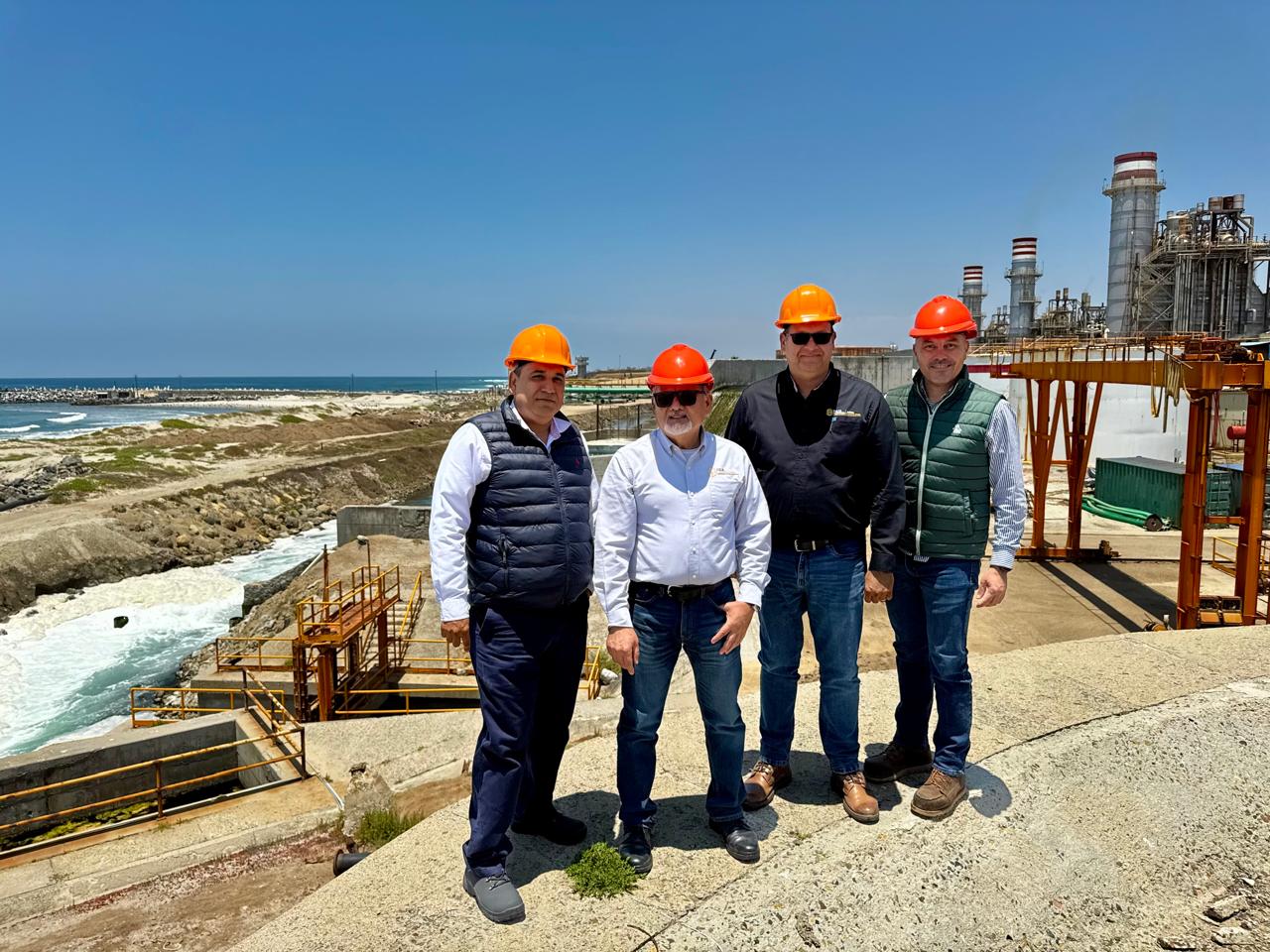 Federal and Baja California water officials inspecting the existing cooling-water channel and Pacific shore beside the Presidente Juarez power station in Rosarito