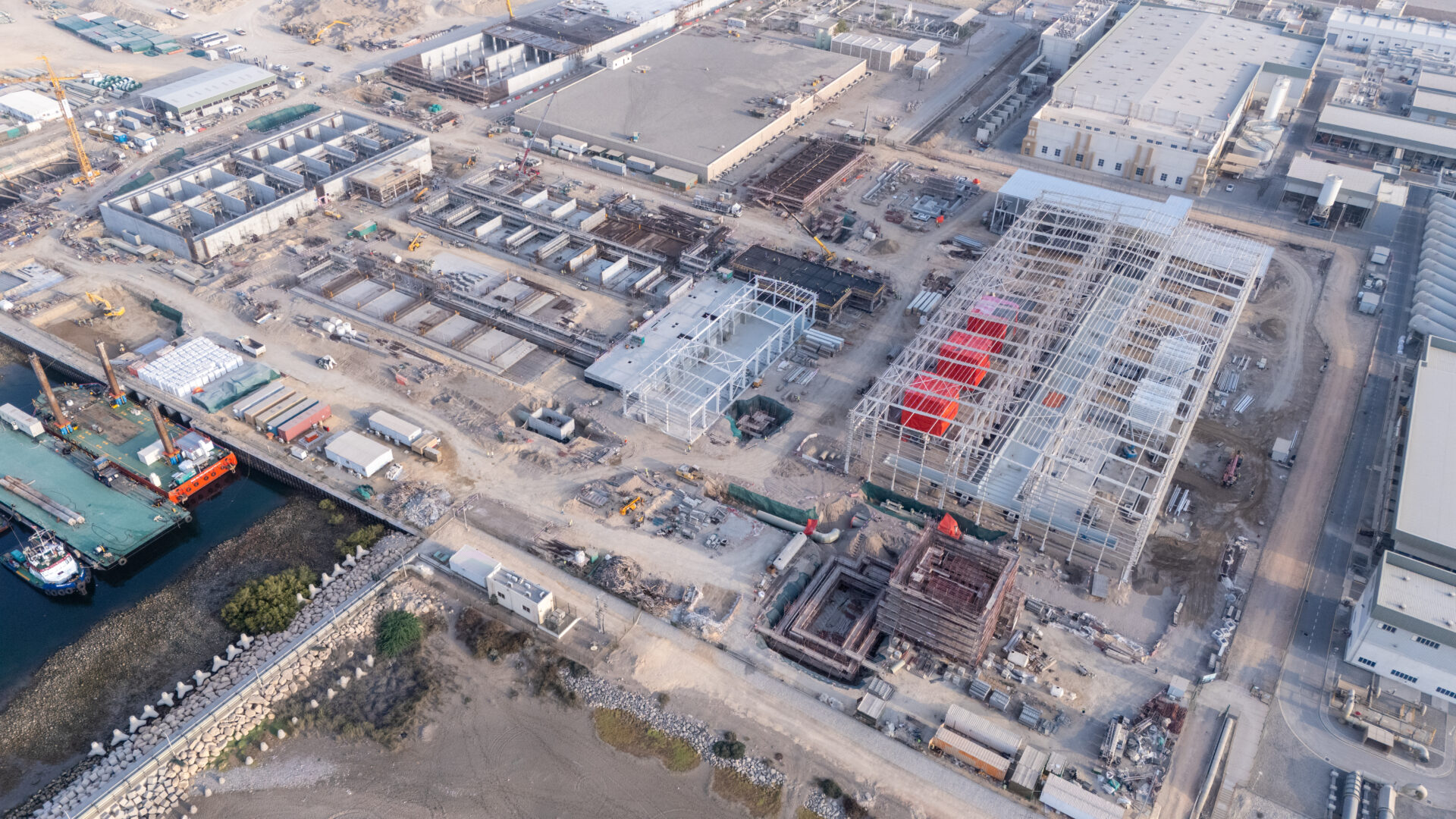 Aerial view of the Ghubrah III desalination plant under construction beside the seawater edge in Muscat
