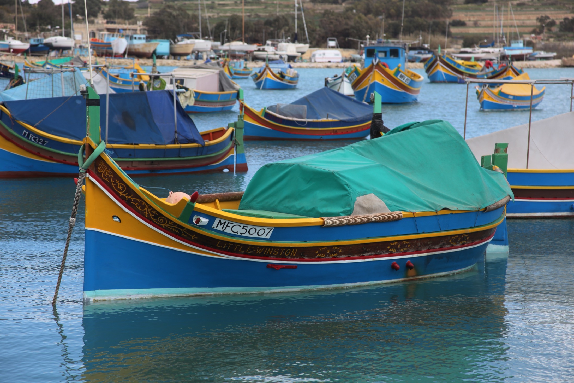 Traditional fishing boats moored in Marsaxlokk Harbour, one of Infrastructure Malta's maritime project locations