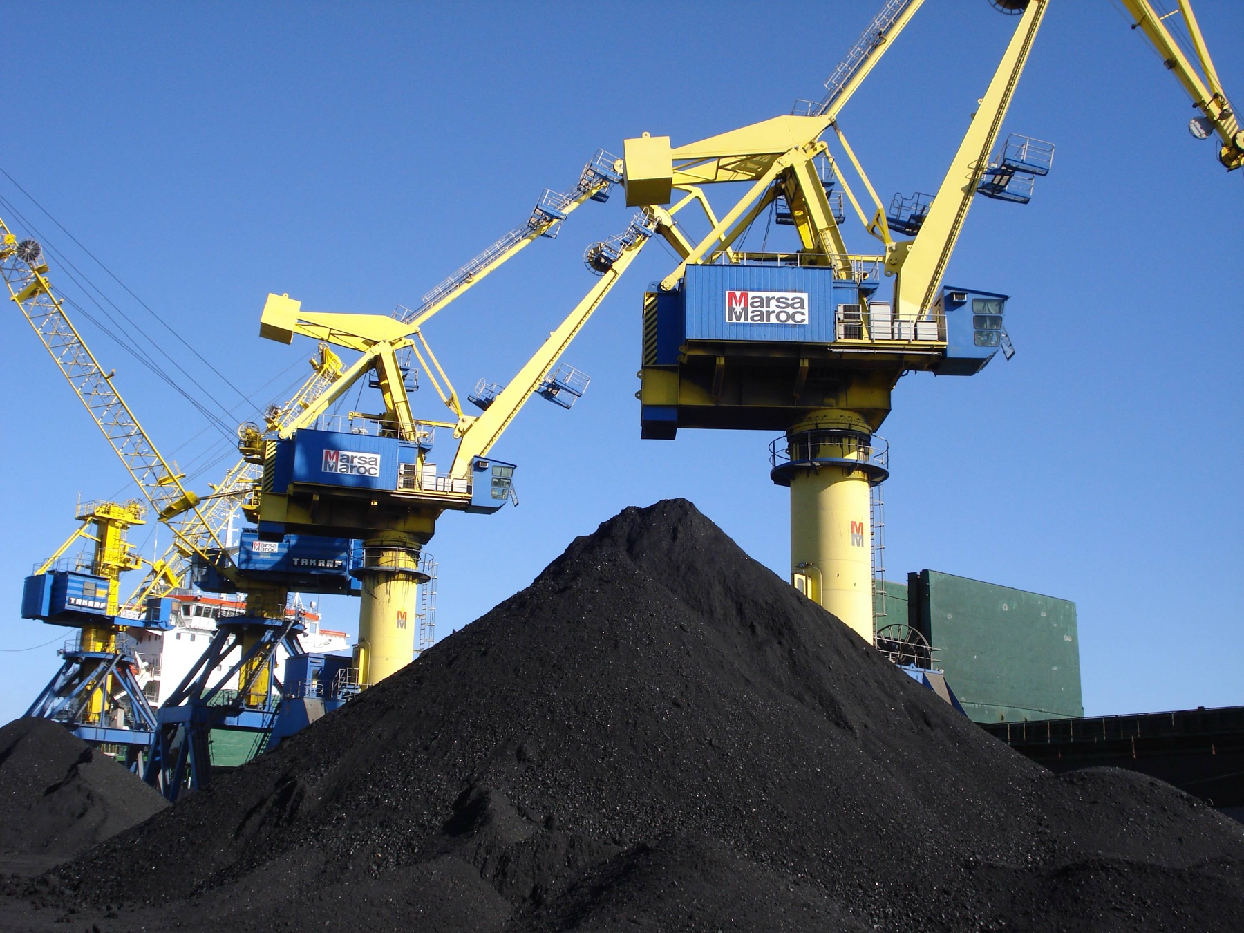 Marsa Maroc bulk-handling cranes working at the existing Port of Nador; the photograph documents the operator's regional activity and is not a Nador West Med construction image