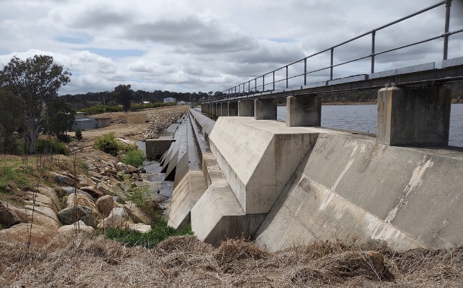 Concrete spillway and reservoir edge at Tenterfield Creek Dam in New South Wales