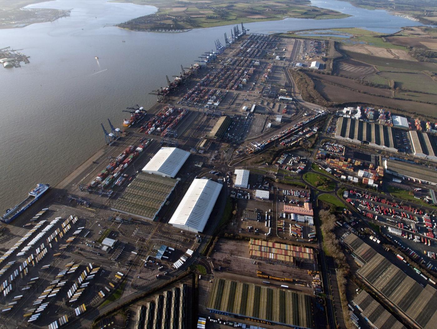 Aerial view of the Port of Felixstowe dock basin, container quays, rail sidings, Ro-Ro berths and the River Orwell