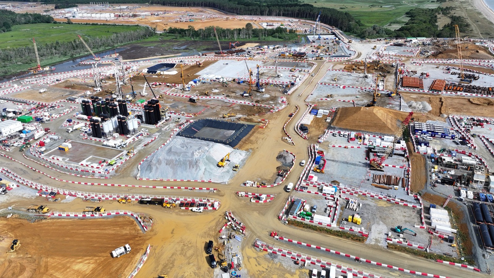 Aerial view of the Sizewell C Main Construction Area under active civil construction beside the Suffolk coast