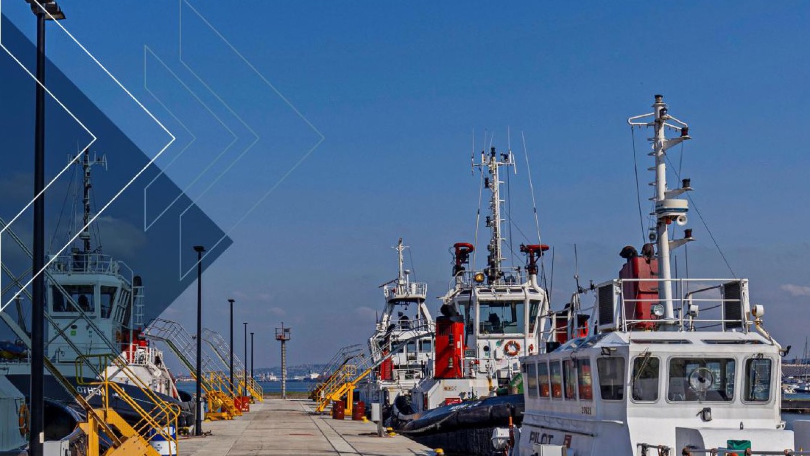 TNPA pilot boats and tugboats berthed for marine services at a South African commercial port