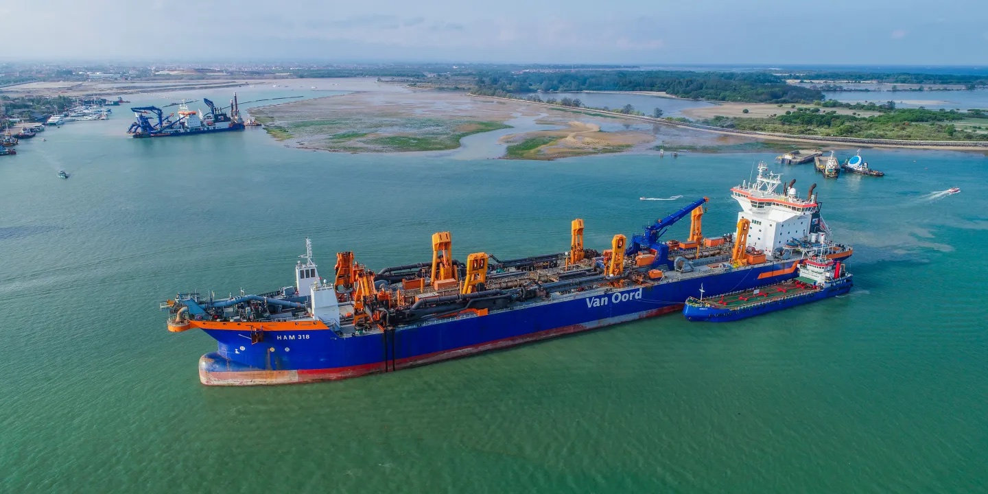 Van Oord trailing suction hopper dredger HAM 318 and cutter suction dredger Artemis working at Benoa Port in Bali