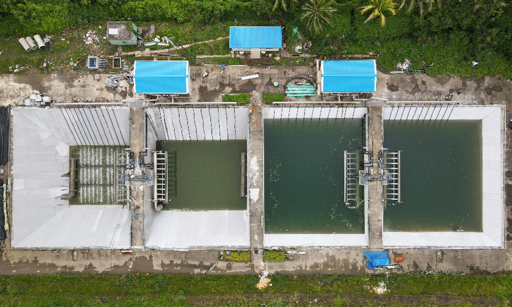 Overhead view of four treatment basins and operating equipment at Kinoya wastewater treatment plant in Suva, Fiji