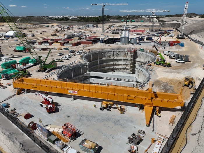 Aerial view of the twin circular tunnel-boring-machine access pits and large gantry crane at the Alkimos Seawater Desalination Plant construction site